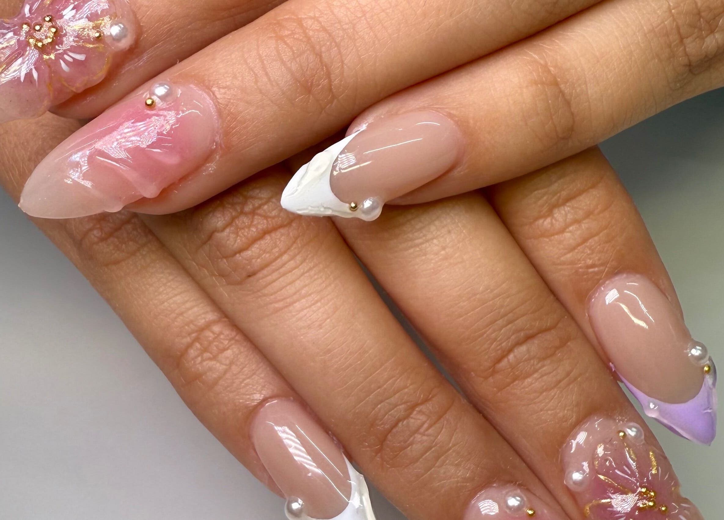 Intricate nail art with floral designs at Fiu Fiu Studio in Chula Vista, California, US.