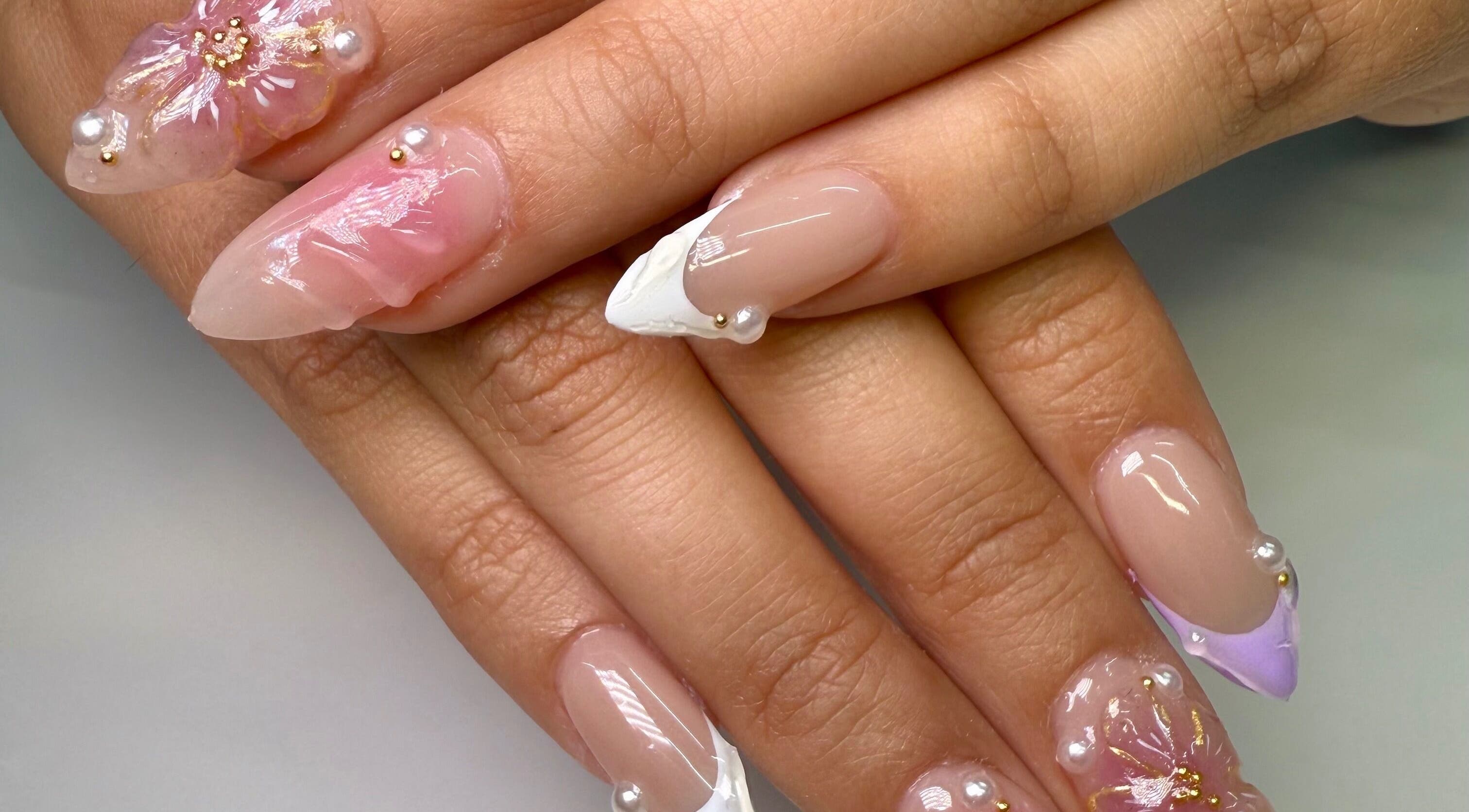 Intricate nail art with floral designs at Fiu Fiu Studio in Chula Vista, California, US.