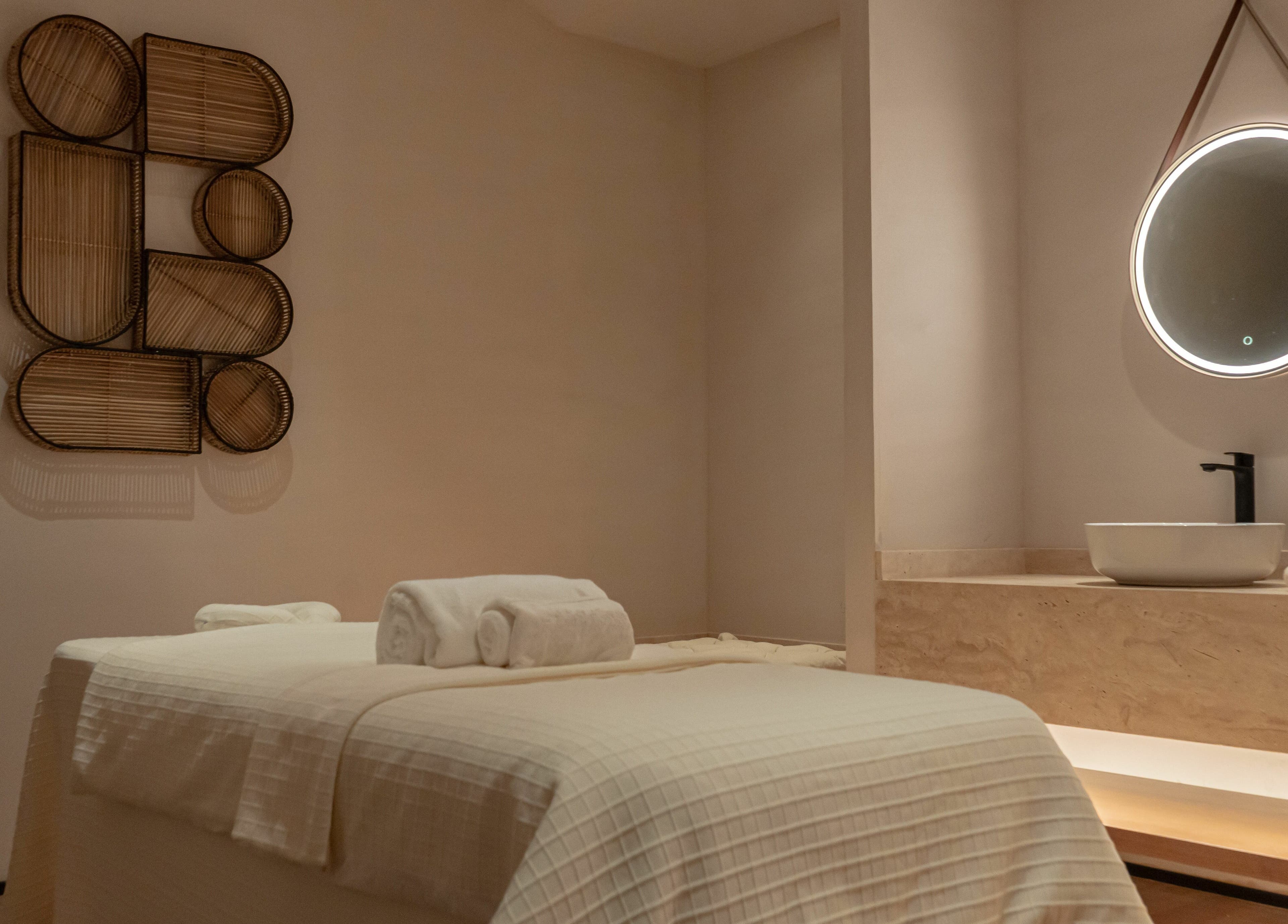 Luxurious treatment room at Another Mars, Dubai, Dubai, AE with a massage table and ambient lighting.