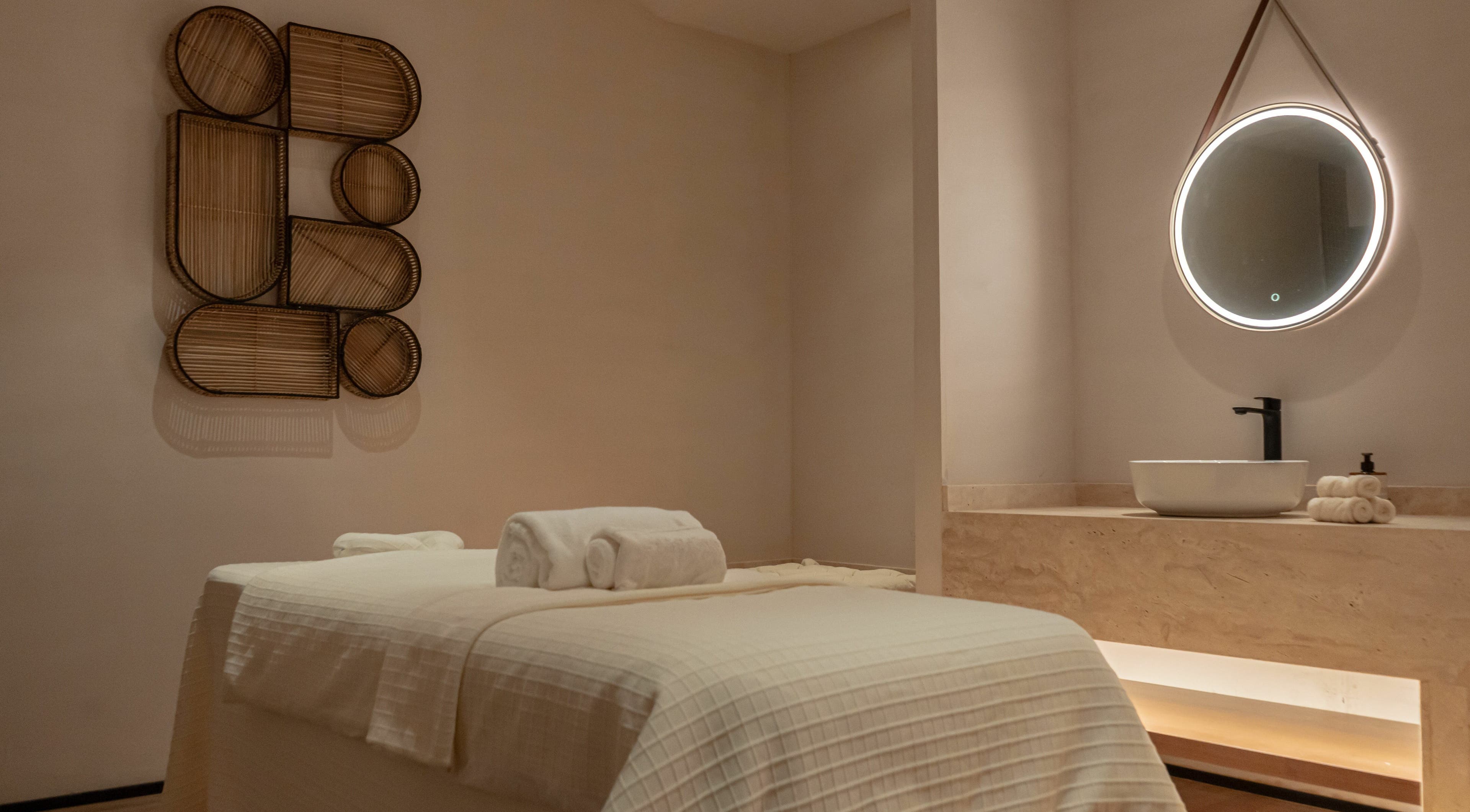 Luxurious treatment room at Another Mars, Dubai, Dubai, AE with a massage table and ambient lighting.