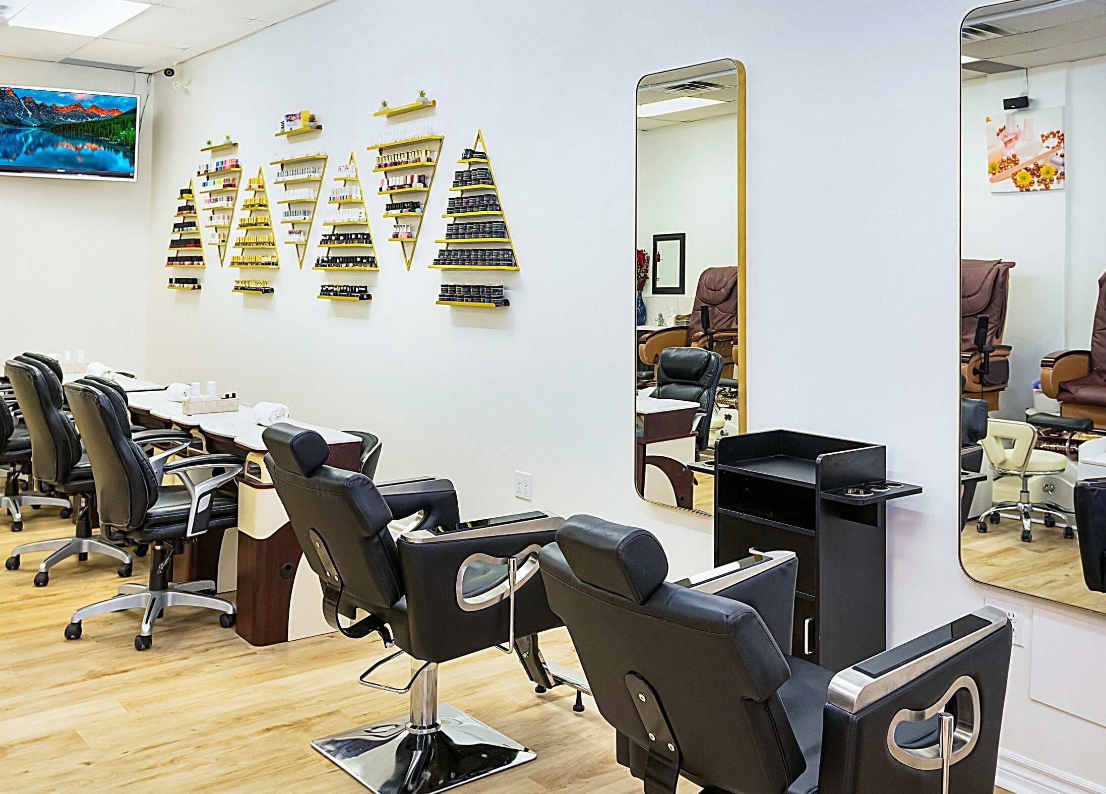 Elegant interior of Divine Day Spa in Ottawa, Ontario, CA featuring stylish salon chairs and wall decor.