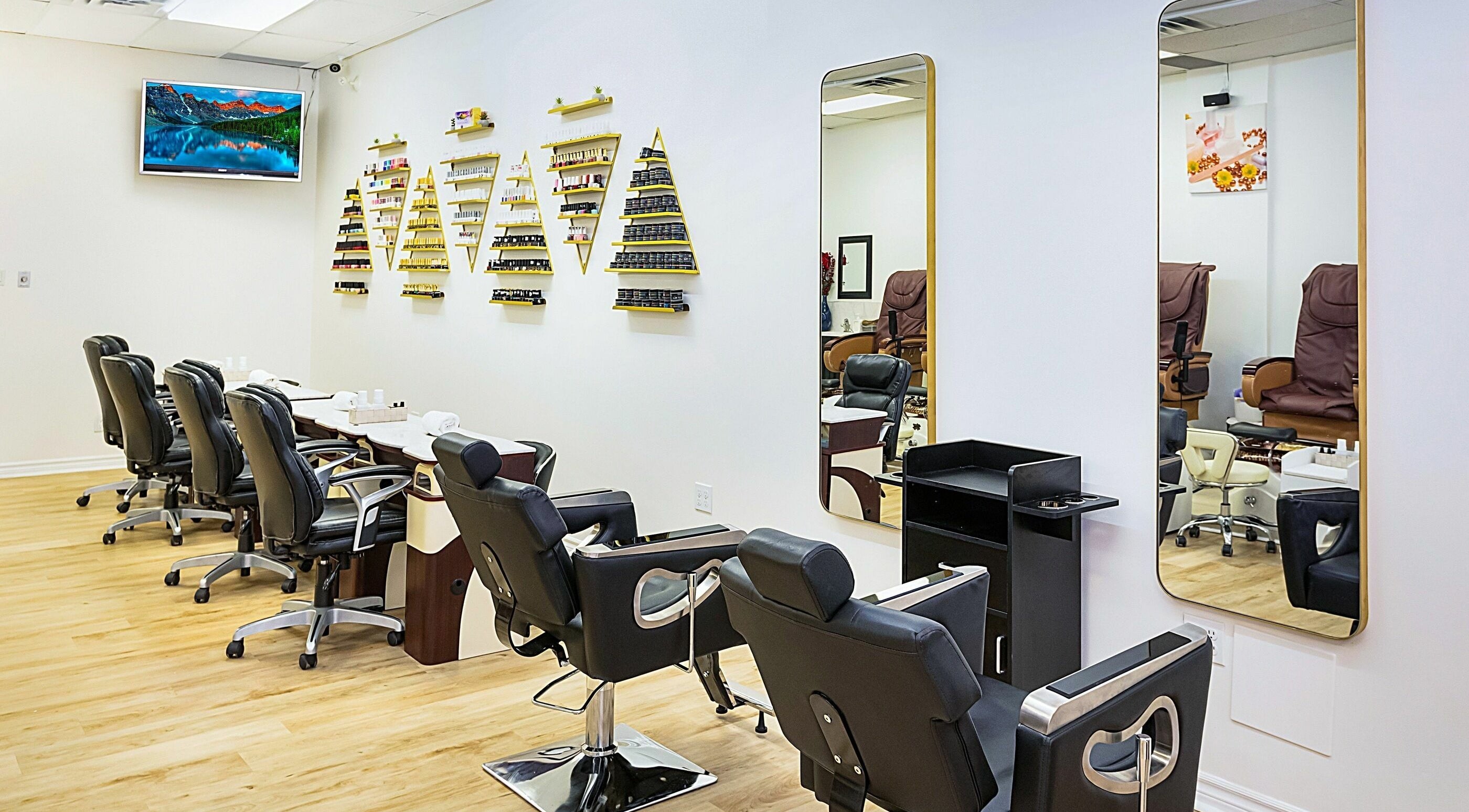 Elegant interior of Divine Day Spa in Ottawa, Ontario, CA featuring stylish salon chairs and wall decor.