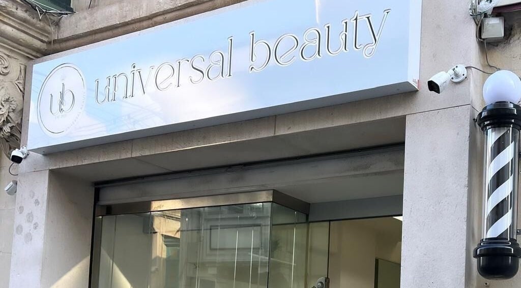 Front view of Universal Beauty Malta's sleek entrance in Tas-sliema, MT with modern signage.