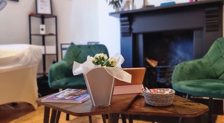 Cozy seating area at Sprinkle Of Magic Lashes - Shoreditch, London, England, GB with stylish decor.