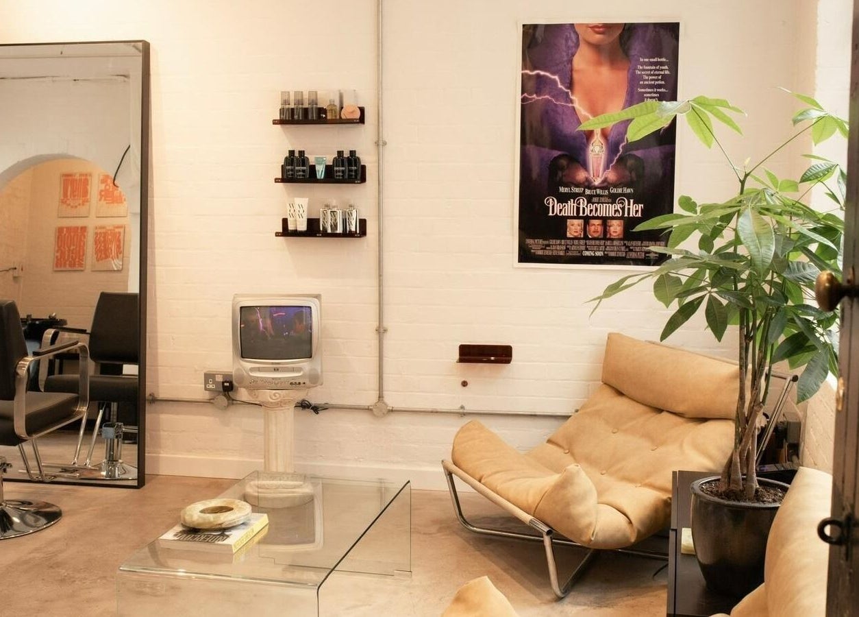 Chic lounge area with sofa and plants at Studio Studios in London, England, GB.