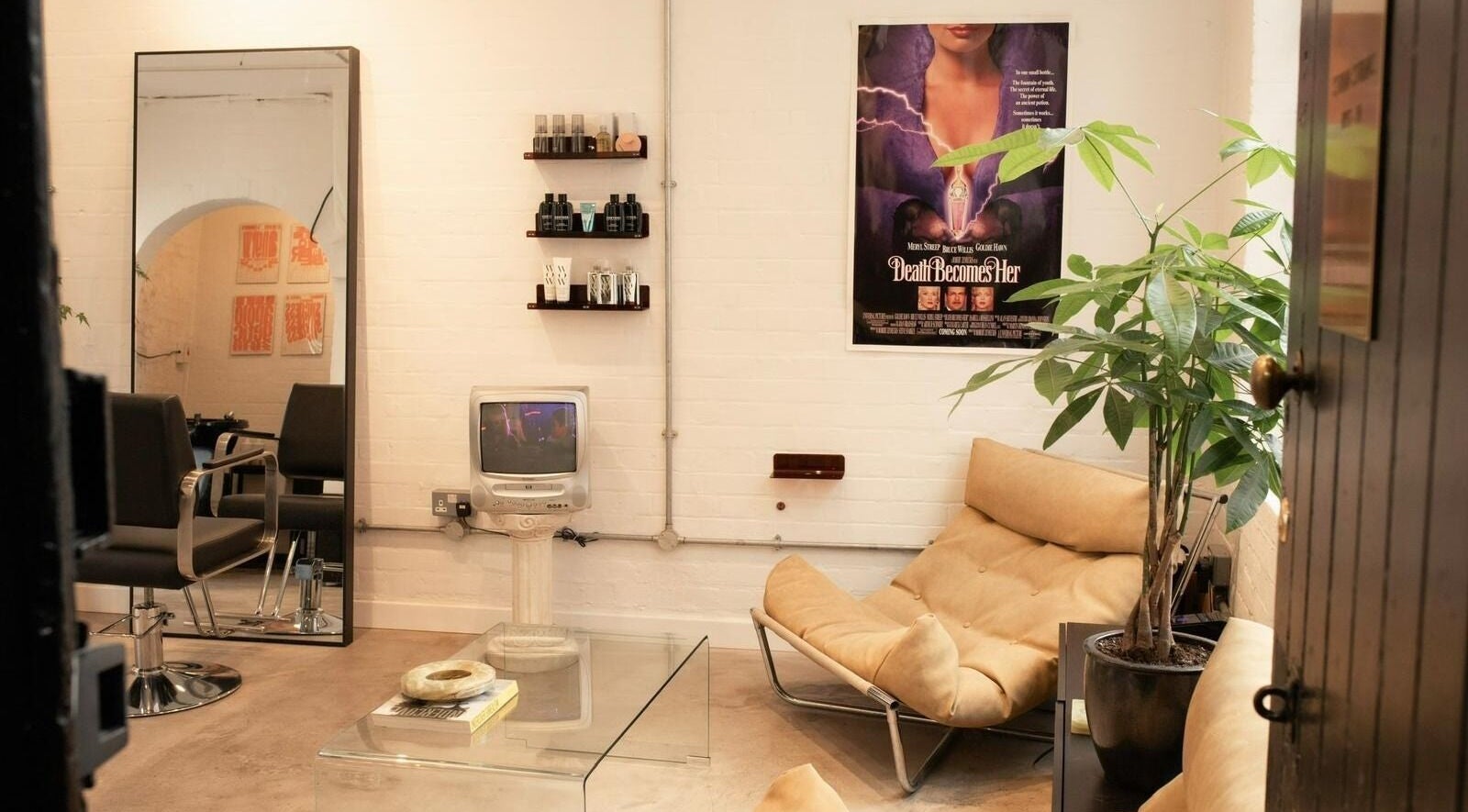 Chic lounge area with sofa and plants at Studio Studios in London, England, GB.