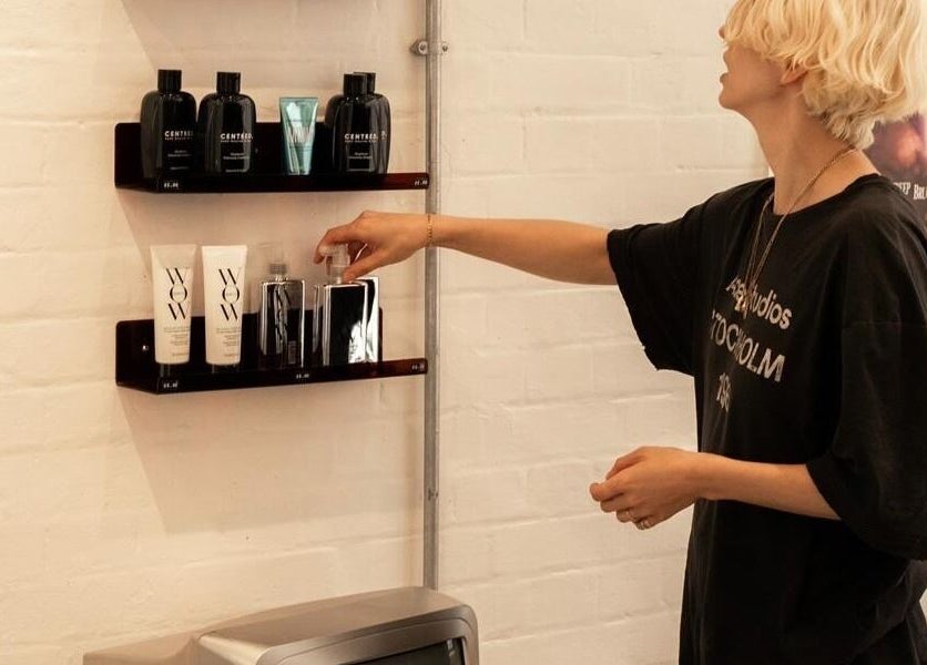 Stylish product shelves at Studio Studios, London, England, GB showcasing beauty essentials.