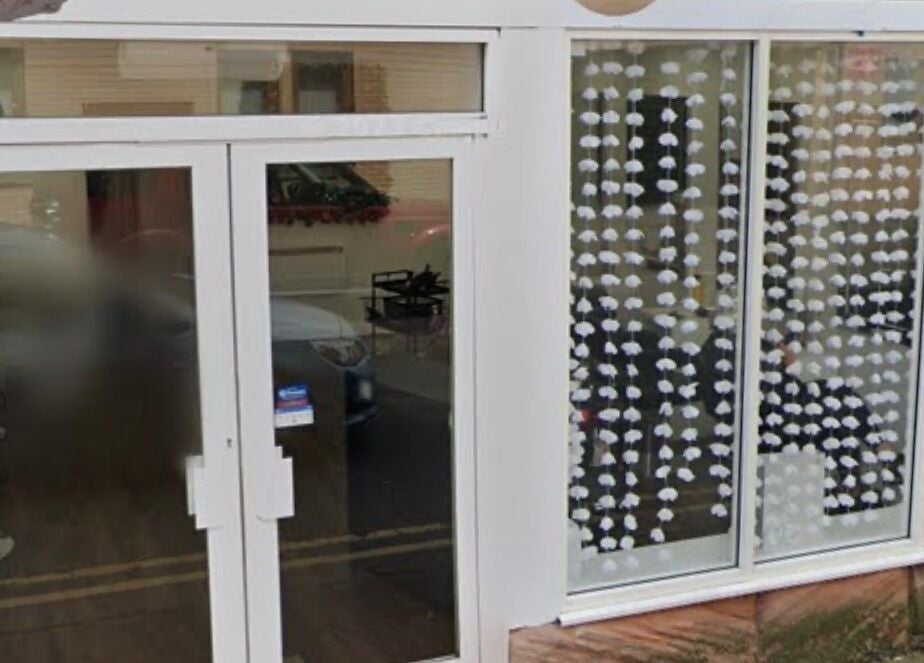 Front view of Beauty by Ally, showcasing modern glass doors in Hamilton, Scotland, GB.