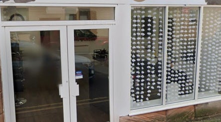 Front view of Beauty by Ally, showcasing modern glass doors in Hamilton, Scotland, GB.