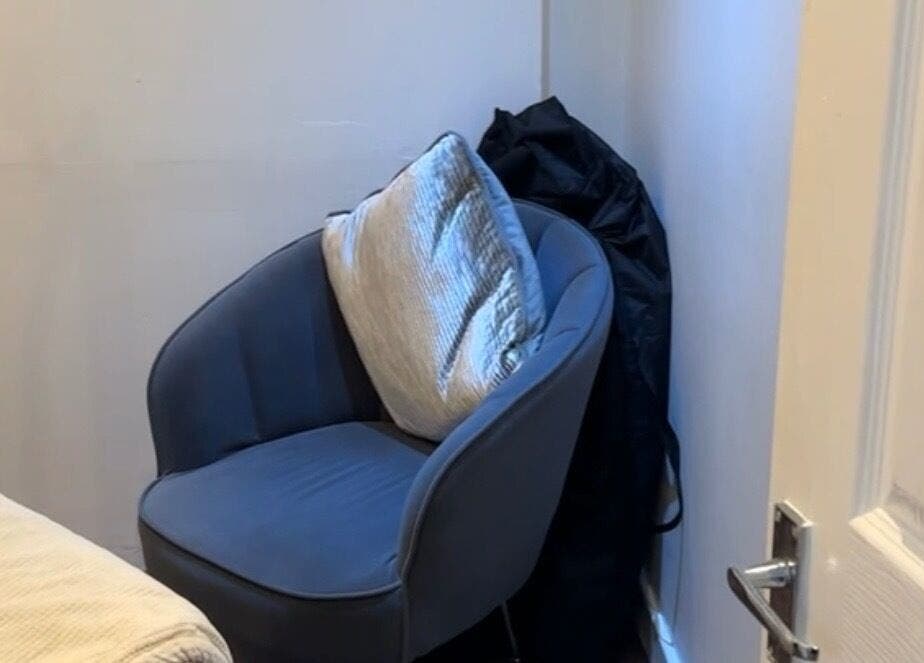 Cozy seating area at Beauty by Ally, Hamilton, Scotland, GB, with plush chair and cushion.