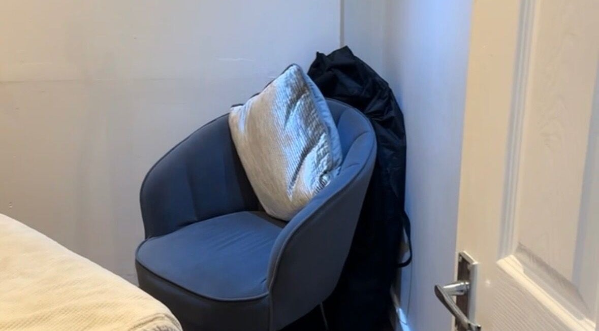 Cozy seating area at Beauty by Ally, Hamilton, Scotland, GB, with plush chair and cushion.