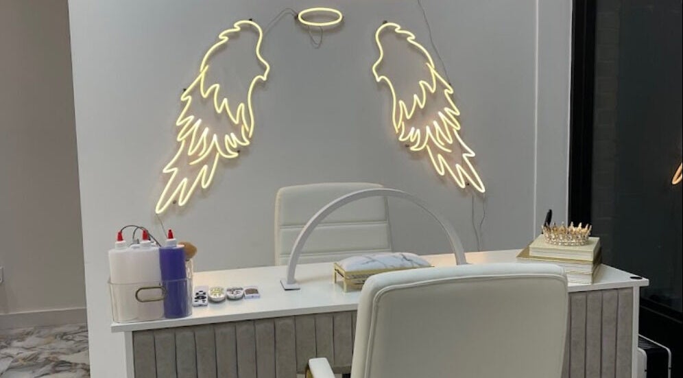 Modern nail station with angel wing lights at House of Nailz™ in Dunstable, England, GB.