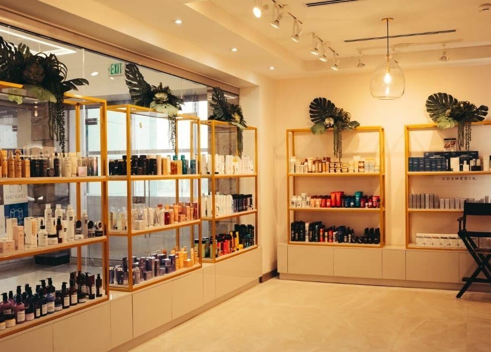 Product shelves at Isla Salon and Spa, Trincity, showcasing a range of beauty products.