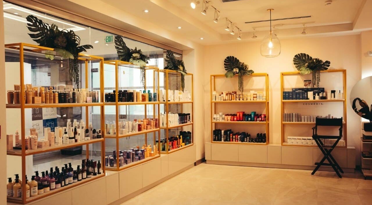 Product shelves at Isla Salon and Spa, Trincity, showcasing a range of beauty products.