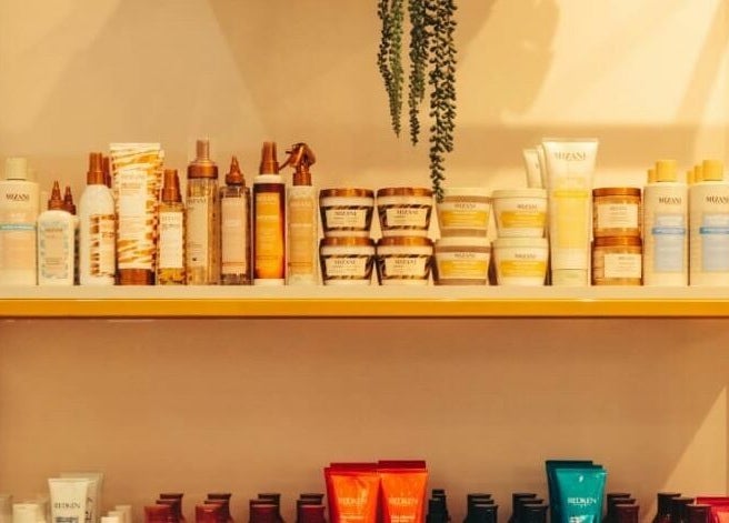 Shelf with beauty products at Isla Salon and Spa in Trincity, Tunapuna/piarco Regional Corporation, TT.