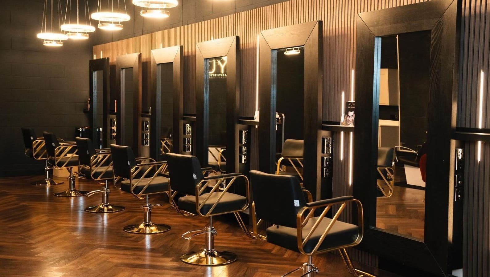 Sleek salon chairs and mirrors at NUYU Hair, Beauty and Aesthetics, Middlesbrough, England, GB.