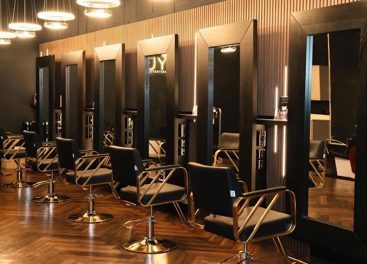 Sleek salon chairs and mirrors at NUYU Hair, Beauty and Aesthetics, Middlesbrough, England, GB.