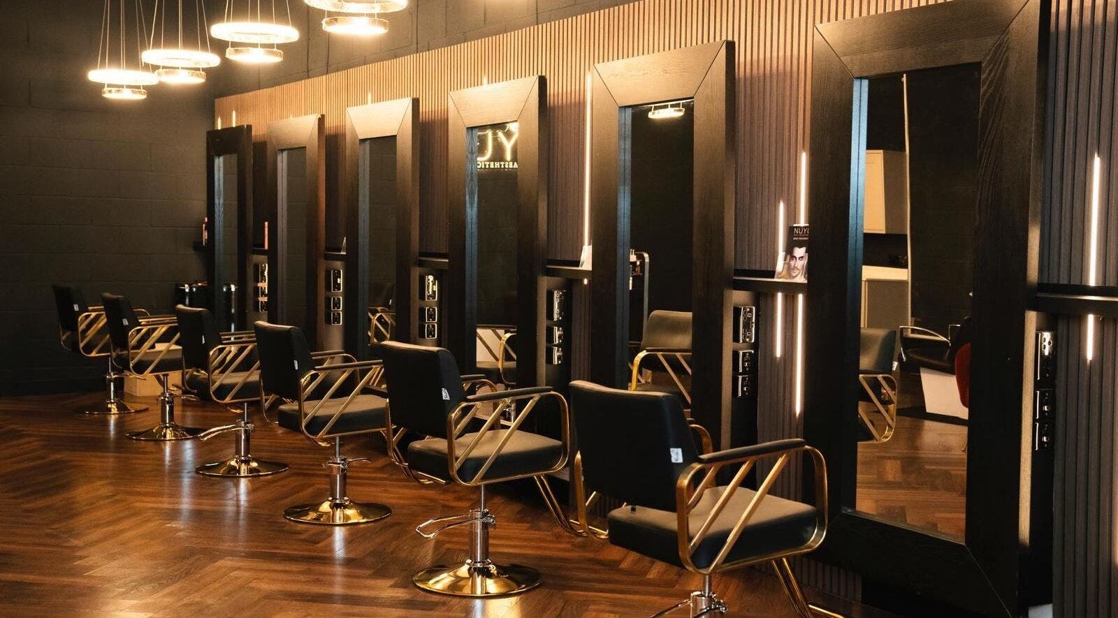 Sleek salon chairs and mirrors at NUYU Hair, Beauty and Aesthetics, Middlesbrough, England, GB.