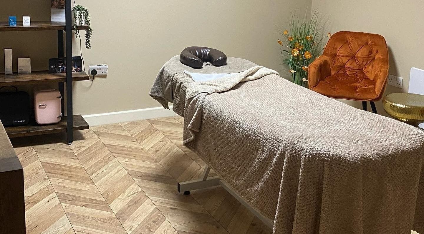 Cozy treatment room at NUYU Hair, Beauty and Aesthetics, Middlesbrough, England, GB featuring a massage table.
