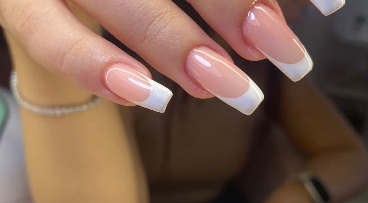French manicure at Karen’s Beauty in Hadath, Mount Lebanon Governorate, LB showcasing elegant nail design.