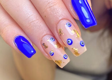 Detailed nail art with blue and gold accents at Karen's Beauty, Hadath, Mount Lebanon Governorate, LB.