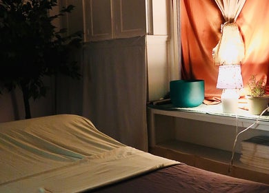 Tranquil massage room at Boon Massage & Healing in Arlington, Massachusetts, US with soft lighting and cozy setup.