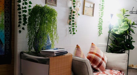 Cozy seating area with plants at Boon Massage & Healing in Arlington, Massachusetts, US.