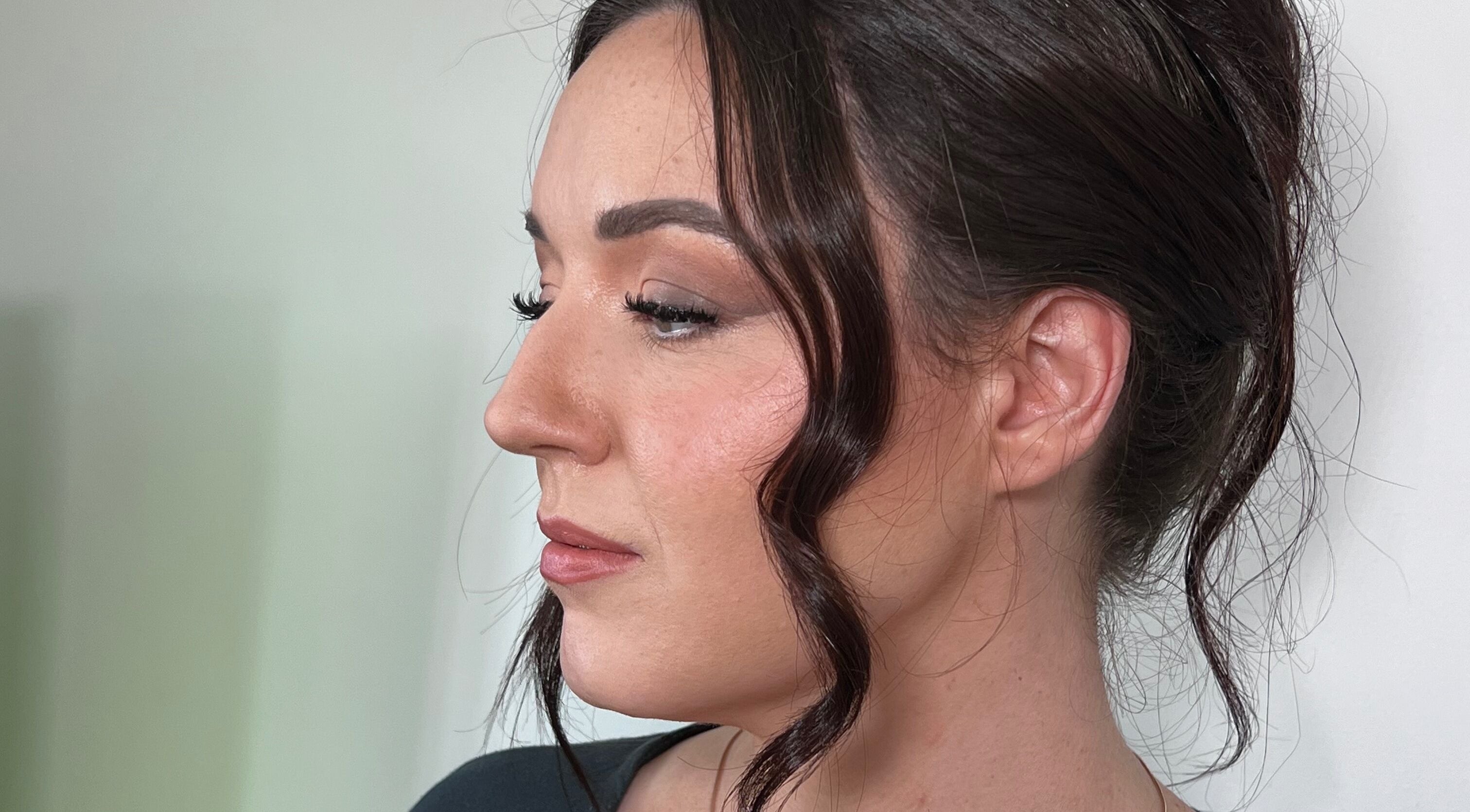 Elegant side profile of a woman with styled hair at The Lux Look, Banyo, Queensland, AU.