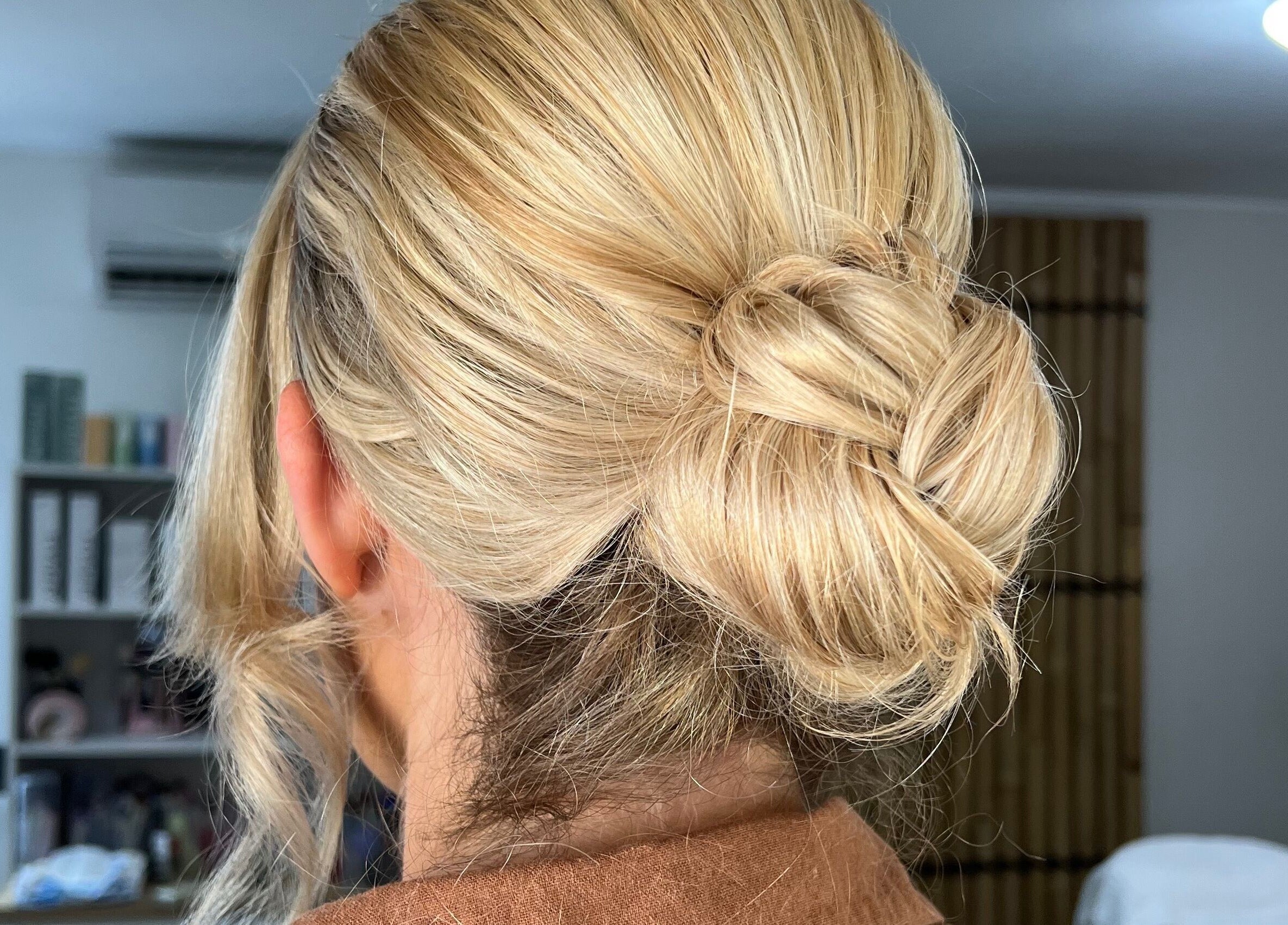 Blonde hair in a stylish updo at The Lux Look, Banyo, Queensland, AU.