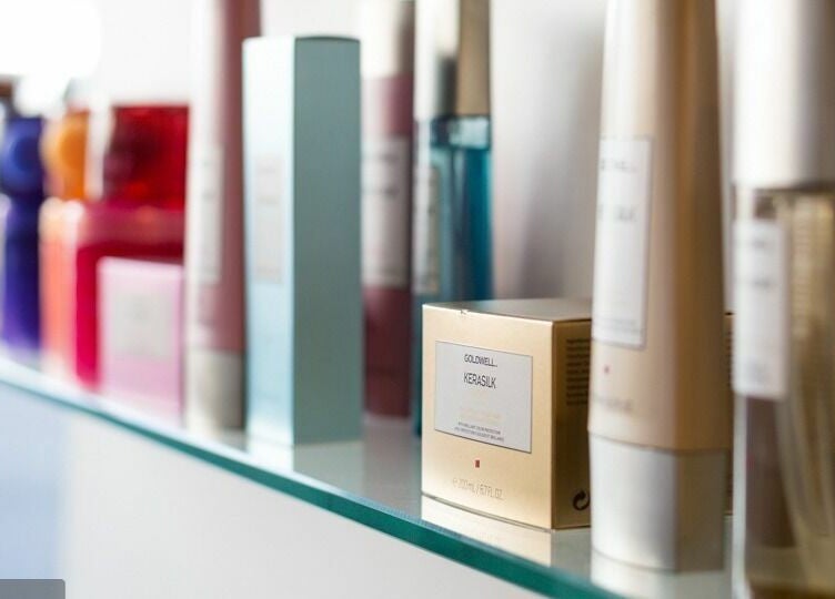 Selection of beauty products on a shelf at Absolute Hair Design, Edgecliff, New South Wales, AU.