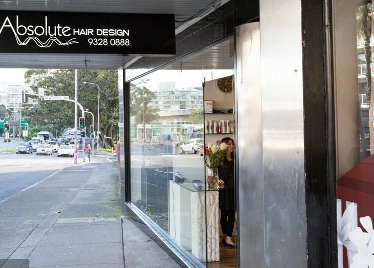 Exterior view of Absolute Hair Design in Edgecliff, New South Wales, AU with a welcoming glass storefront.