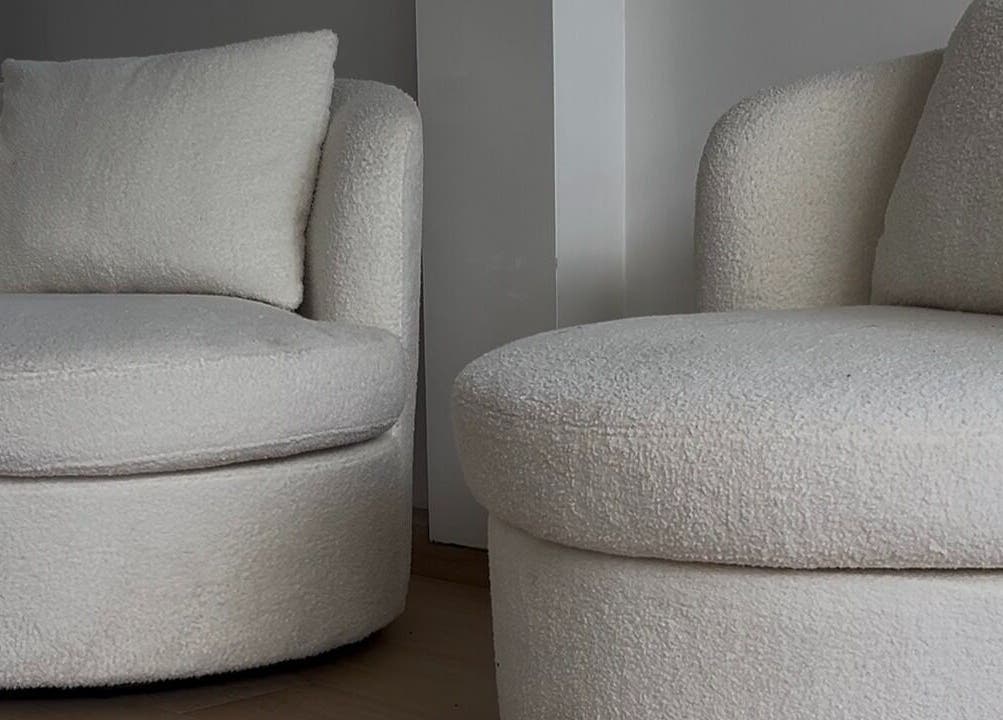 Plush white chairs at Onlylashessx, Green Valley, New South Wales, AU, exude comfort and style in modern decor.