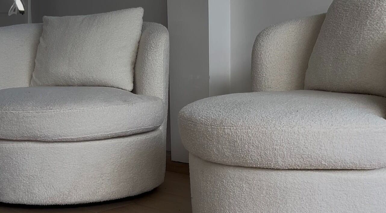 Plush white chairs at Onlylashessx, Green Valley, New South Wales, AU, exude comfort and style in modern decor.
