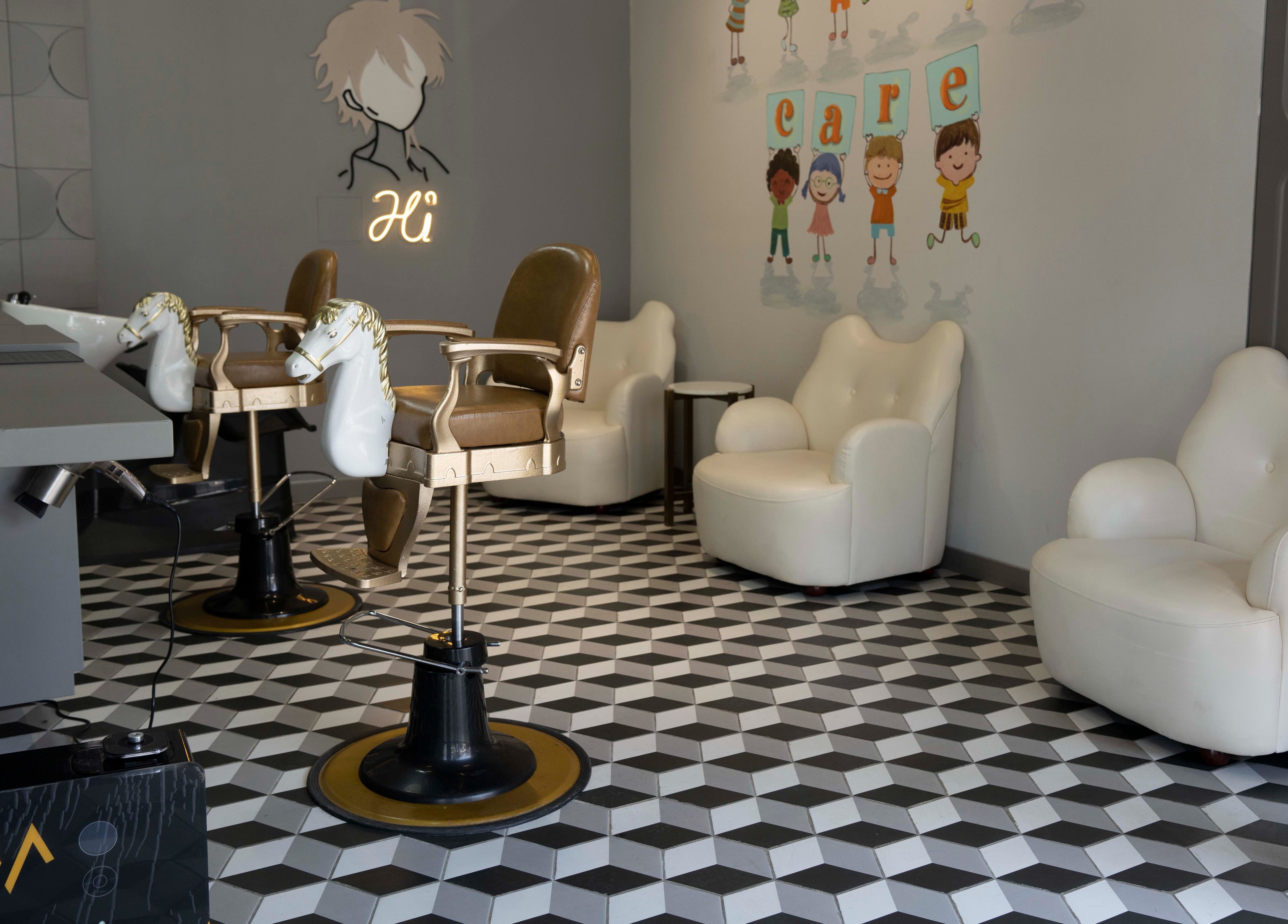 Chic interior of Secret Care barber Shop in Sharjah, AE with stylish chairs and modern decor.