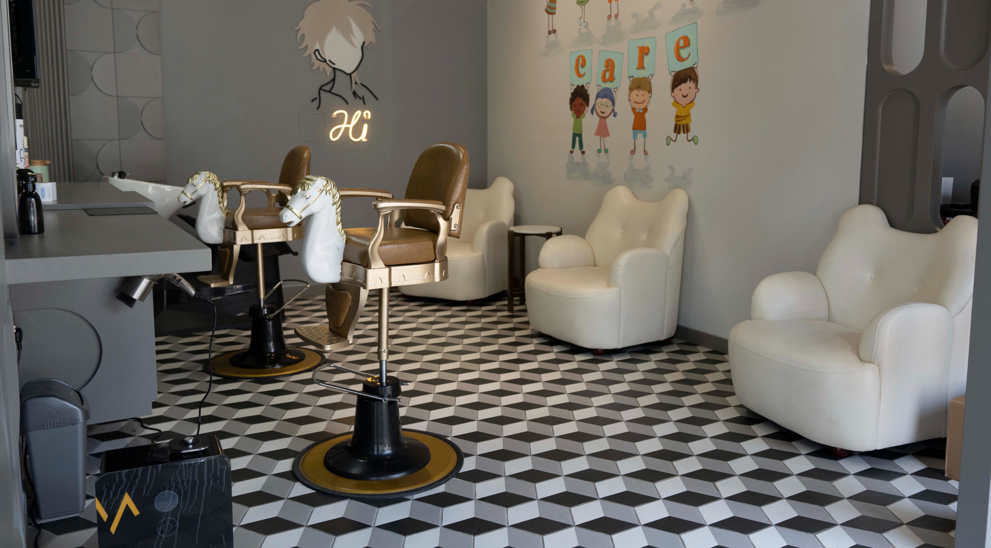 Chic interior of Secret Care barber Shop in Sharjah, AE with stylish chairs and modern decor.