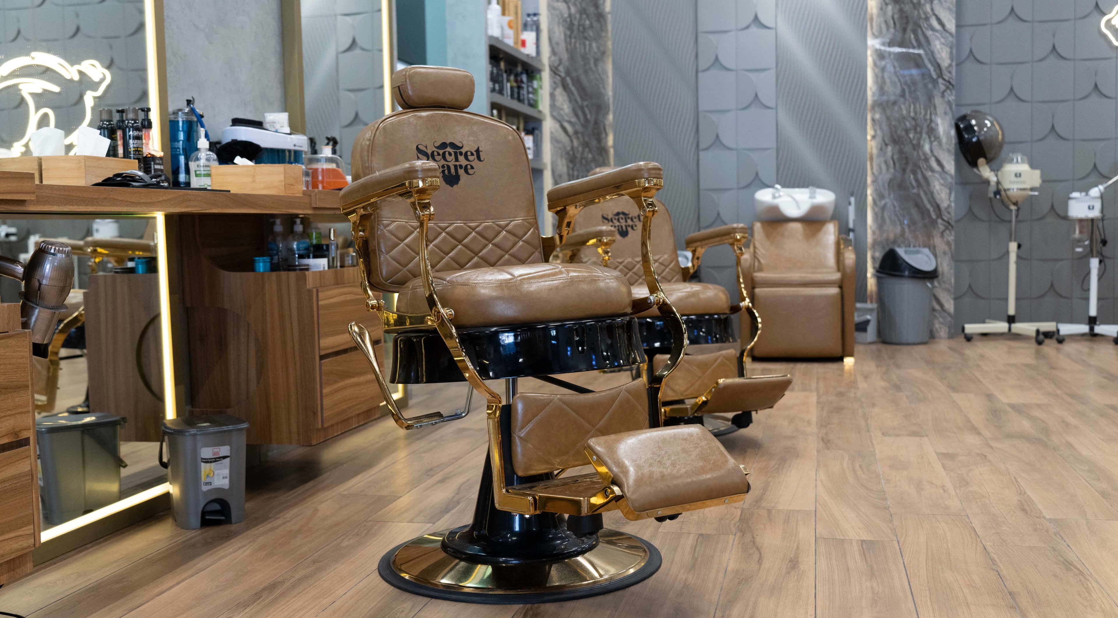 Luxurious barber chairs at Secret Care Barber Shop, Sharjah, Sharjah, AE, offering premium grooming services.
