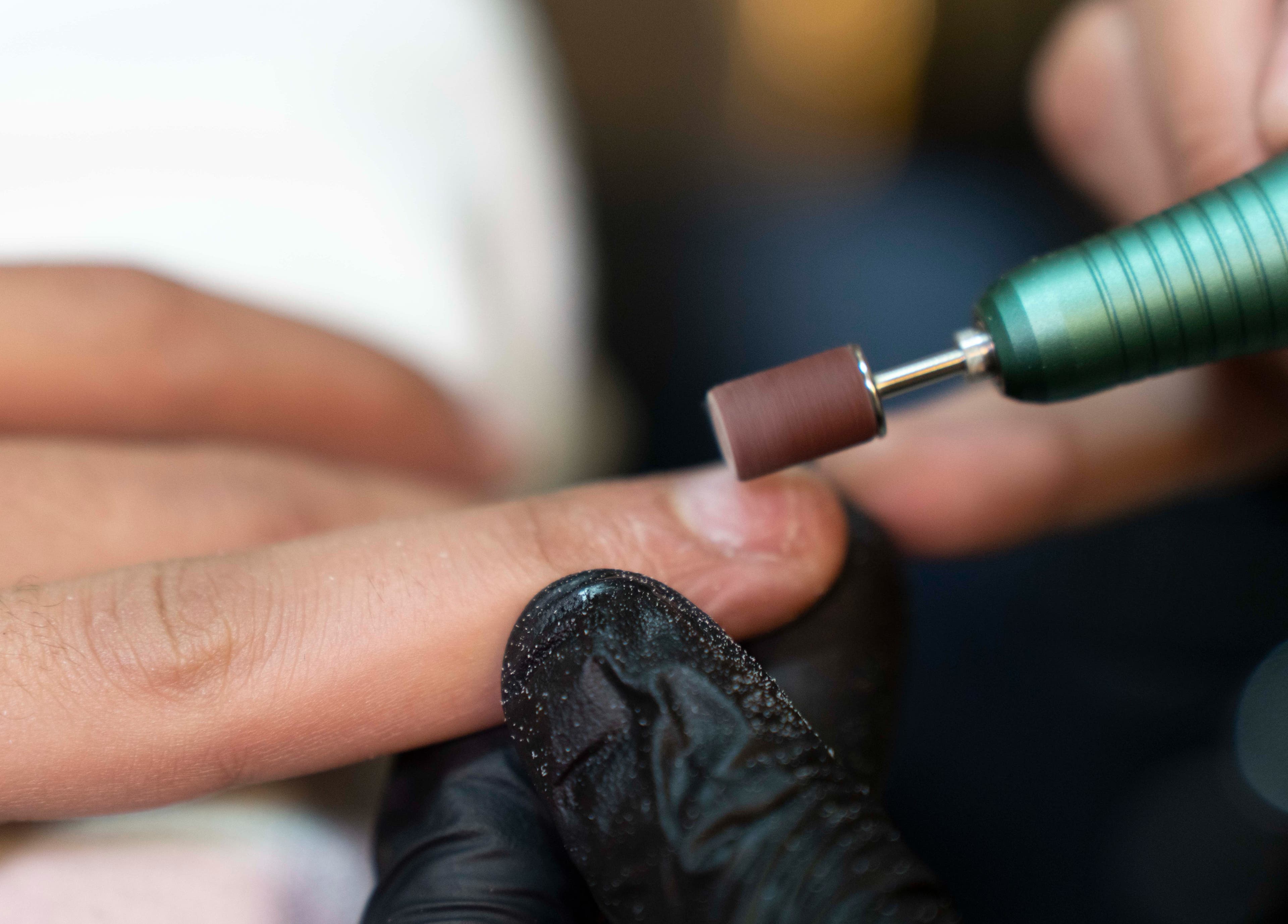 Nail care service at Secret Care barber Shop, Sharjah, Sharjah, AE showcasing close-up of nail polishing.