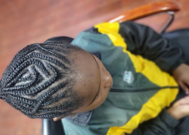 Intricate braid hairstyle at Enhle Afro Salon, Mthatha, Eastern Cape, ZA, showcasing expert craftsmanship.