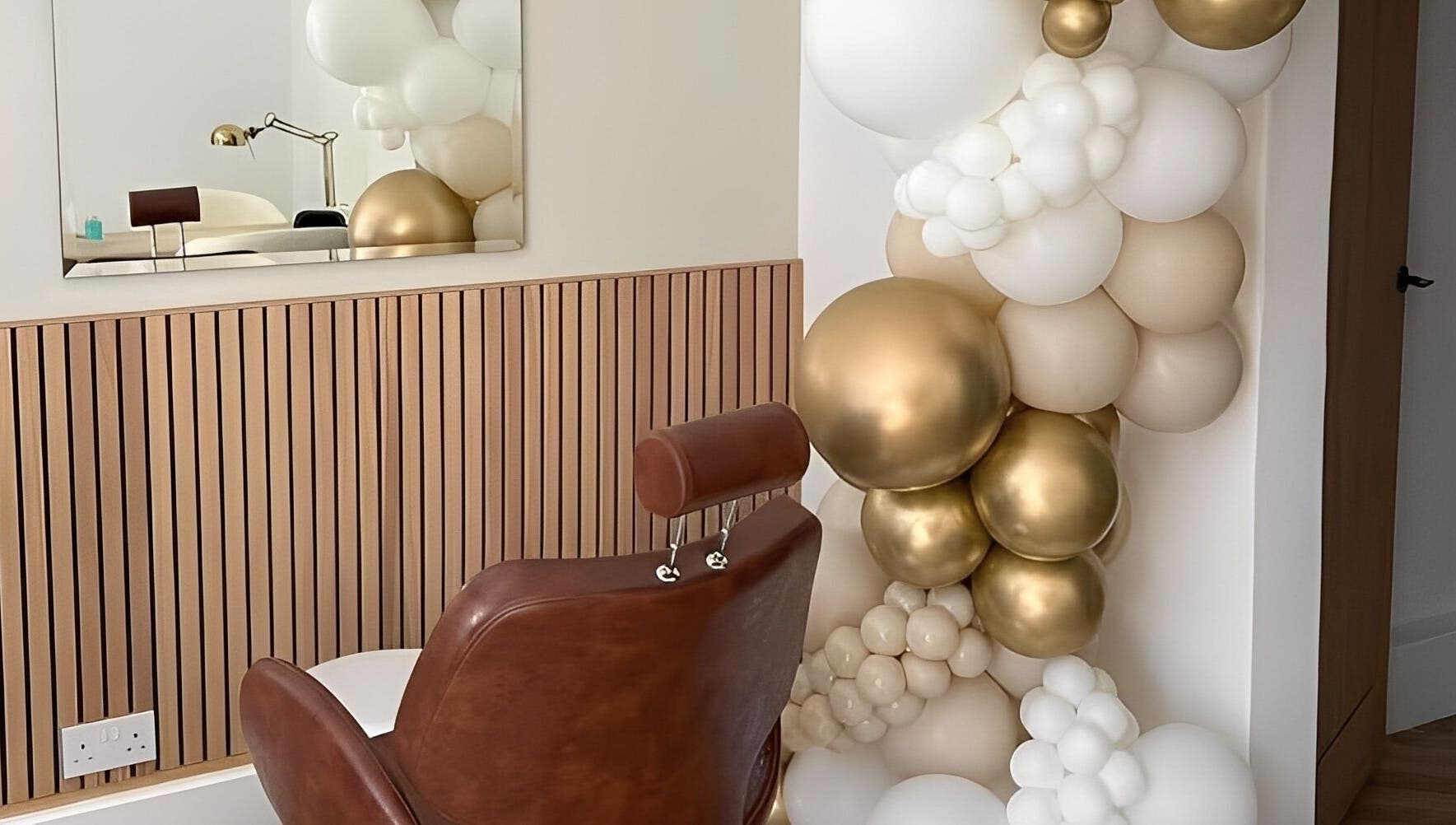 Luxurious salon chair with gold and white decor at By Bex and Co, Selby, England, GB.