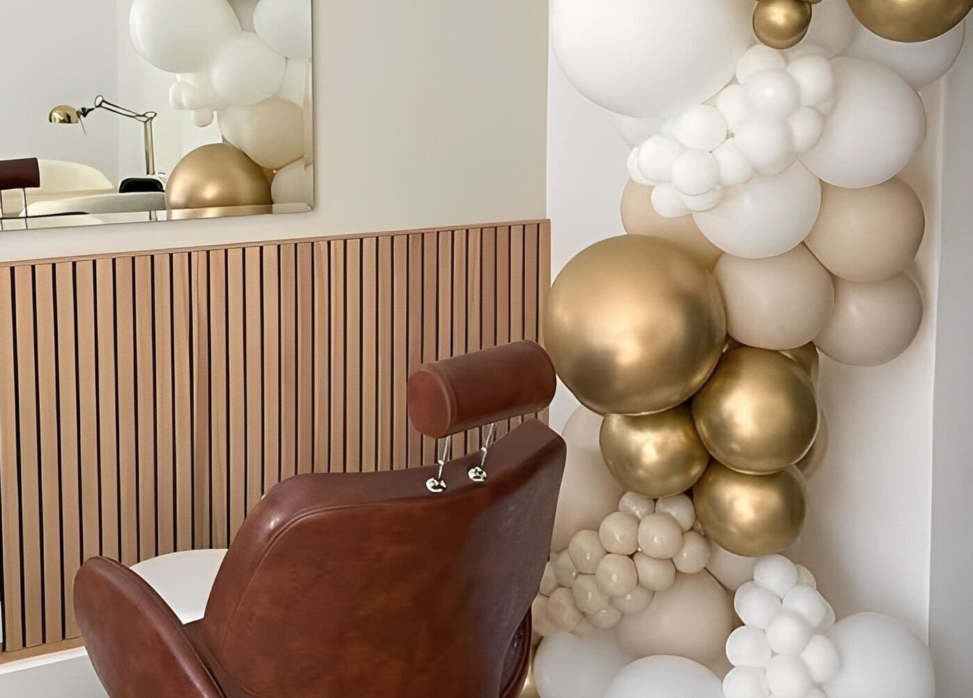 Luxurious salon chair with gold and white decor at By Bex and Co, Selby, England, GB.