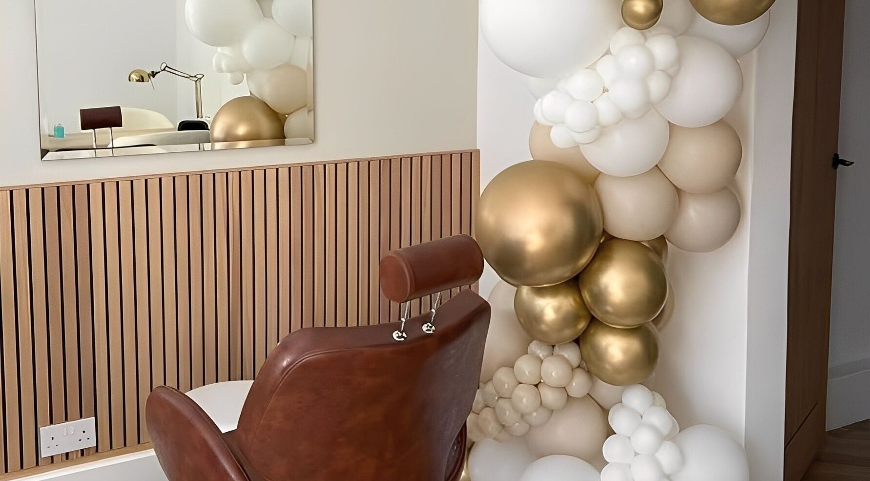 Luxurious salon chair with gold and white decor at By Bex and Co, Selby, England, GB.