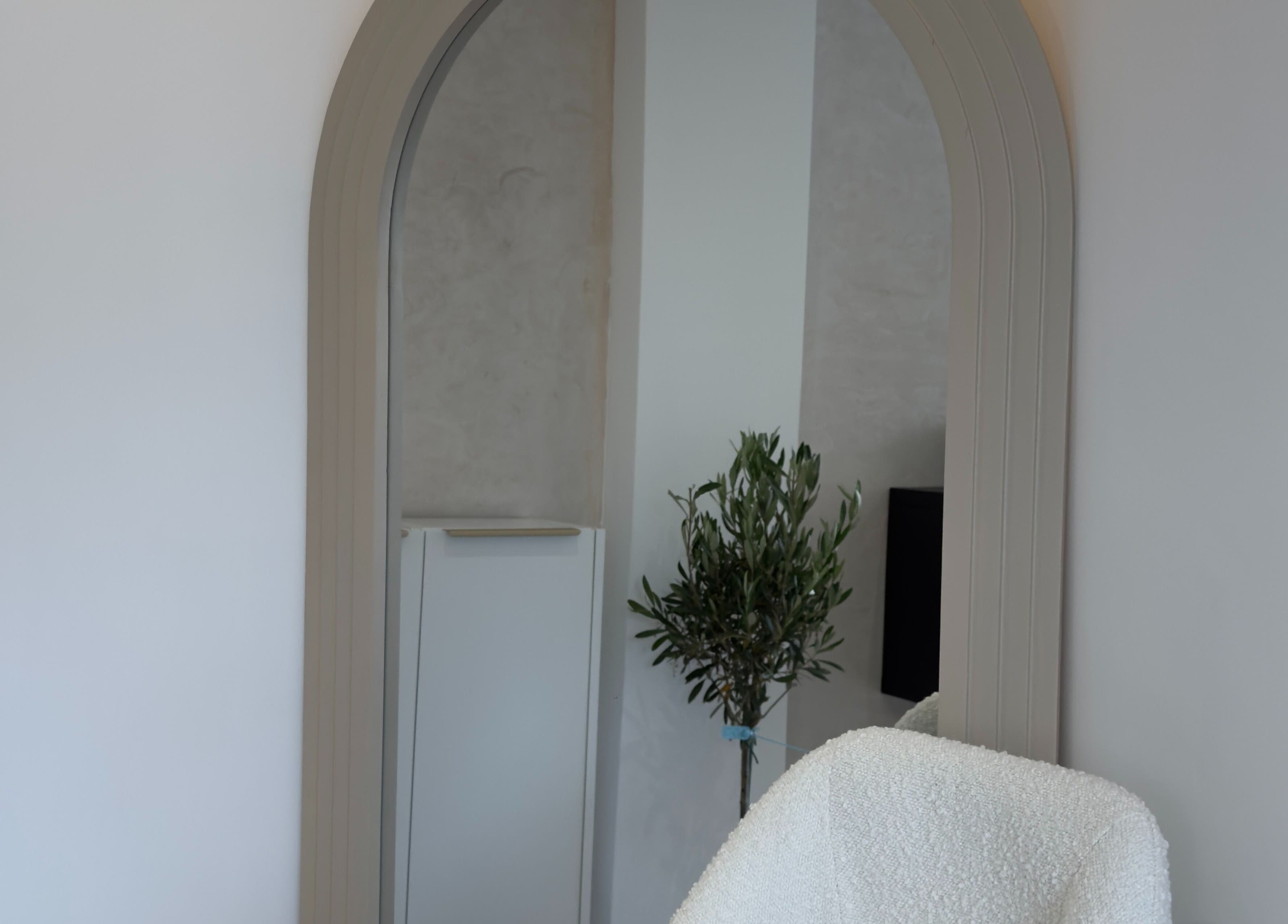 Elegant mirror and cozy chair at By Bex and Co, Selby, England, GB reflecting calm atmosphere.