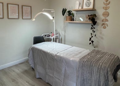 Relaxing therapy room at New Moon Brow Artistry in Randburg, Gauteng, ZA, featuring a cozy treatment bed.