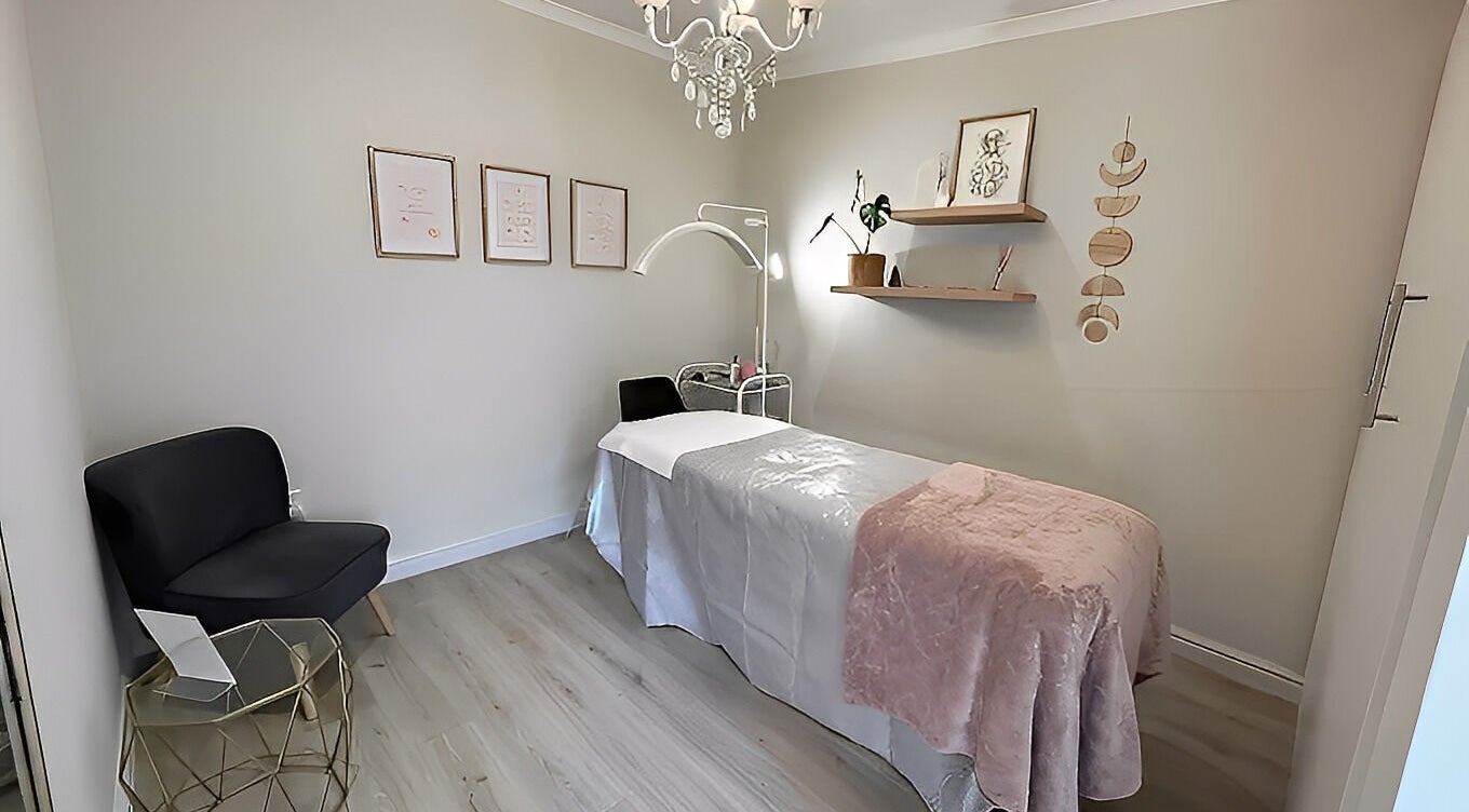 Tranquil treatment room at New Moon Brow Artistry, Randburg, Gauteng, ZA, featuring elegant decor and massage table.