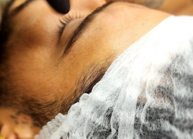 Client enjoying eyelash extension at Sattva Aesthetics | Wellness Bonaire | Aura Tattoo, Kralendijk, Bonaire, BQ.