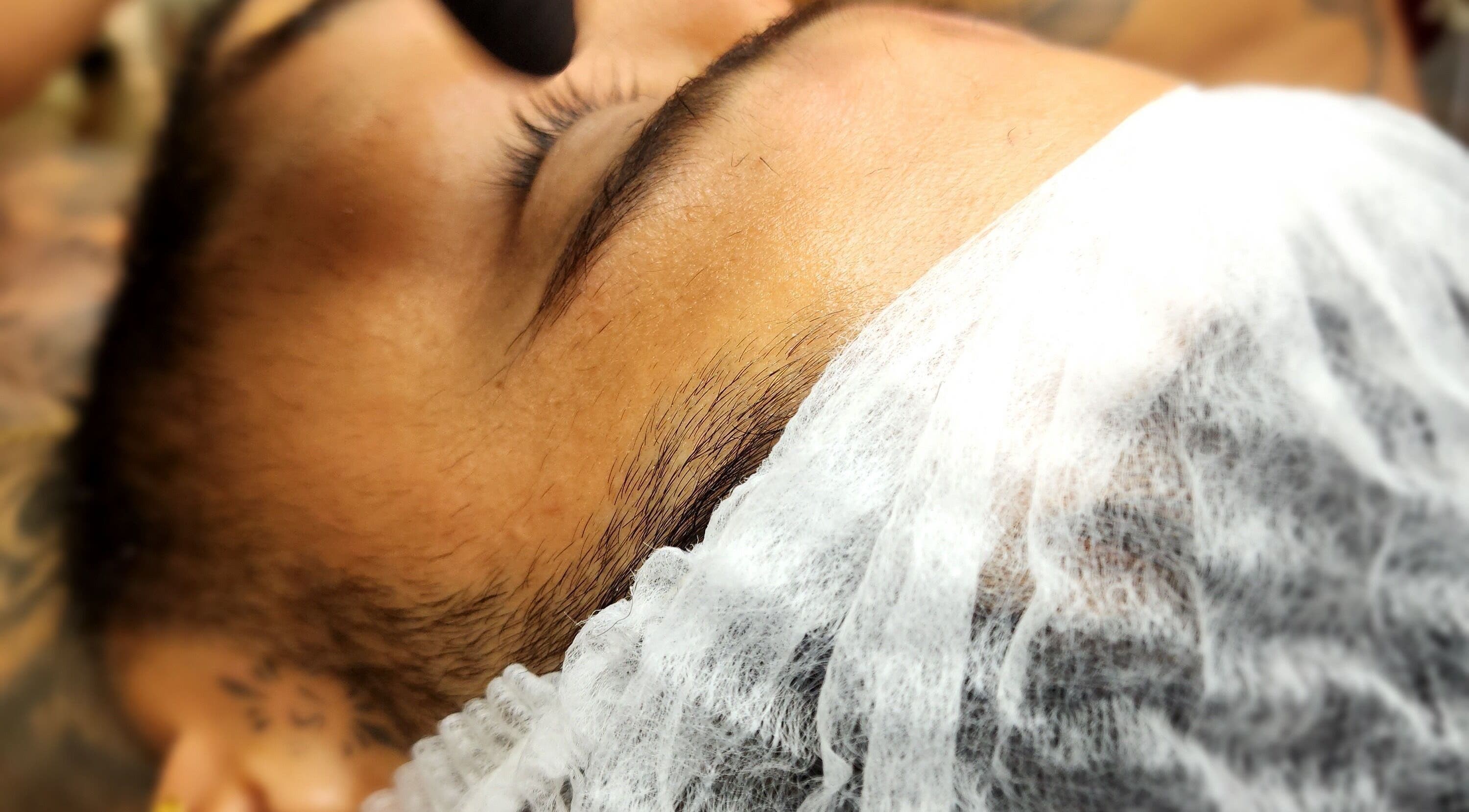 Client enjoying eyelash extension at Sattva Aesthetics | Wellness Bonaire | Aura Tattoo, Kralendijk, Bonaire, BQ.