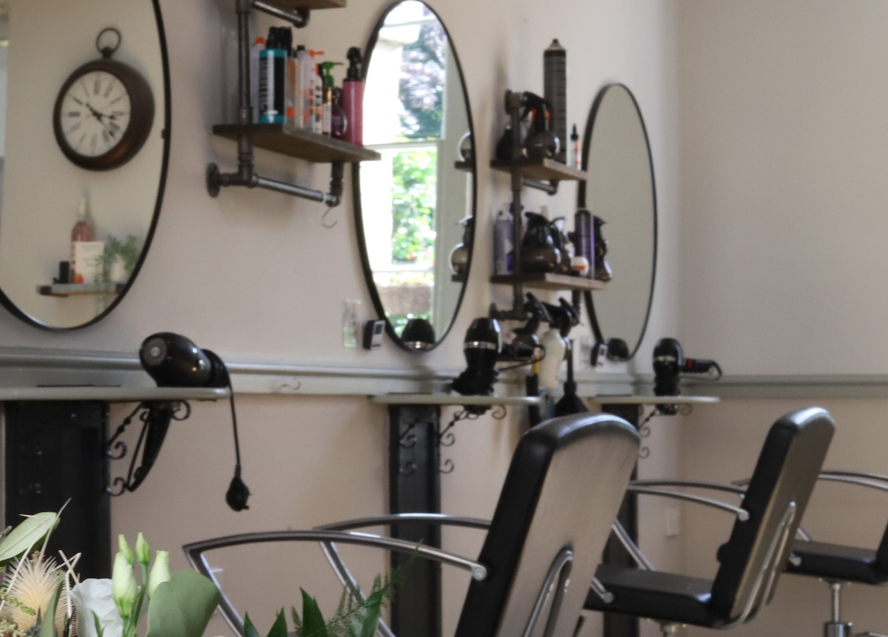 Stylish interior of Strawberry Fields Hair Design in Corsham, England, GB showcasing elegant styling stations.