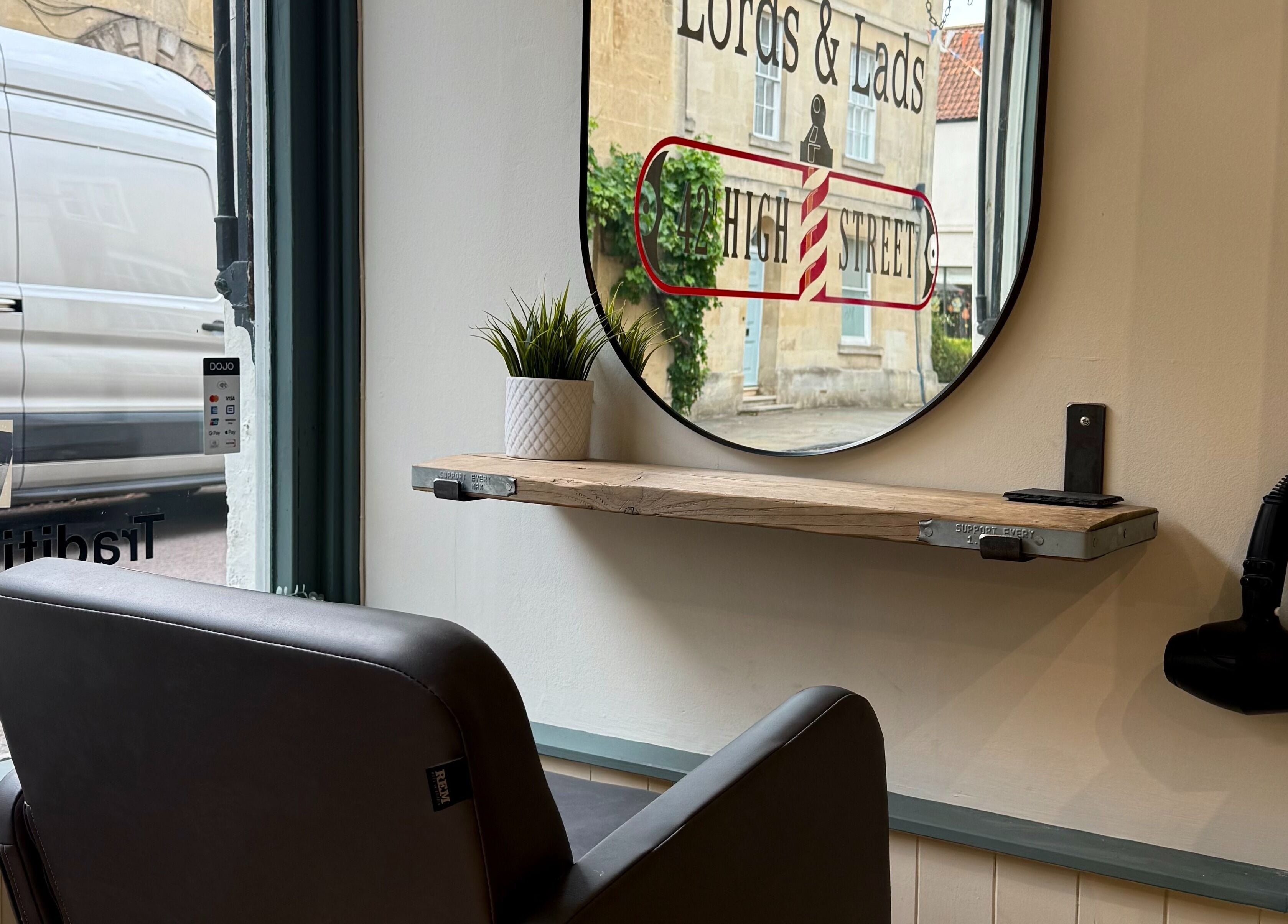 Modern salon chair and mirror setup at Strawberry Fields Hair Design, Corsham, England, GB.