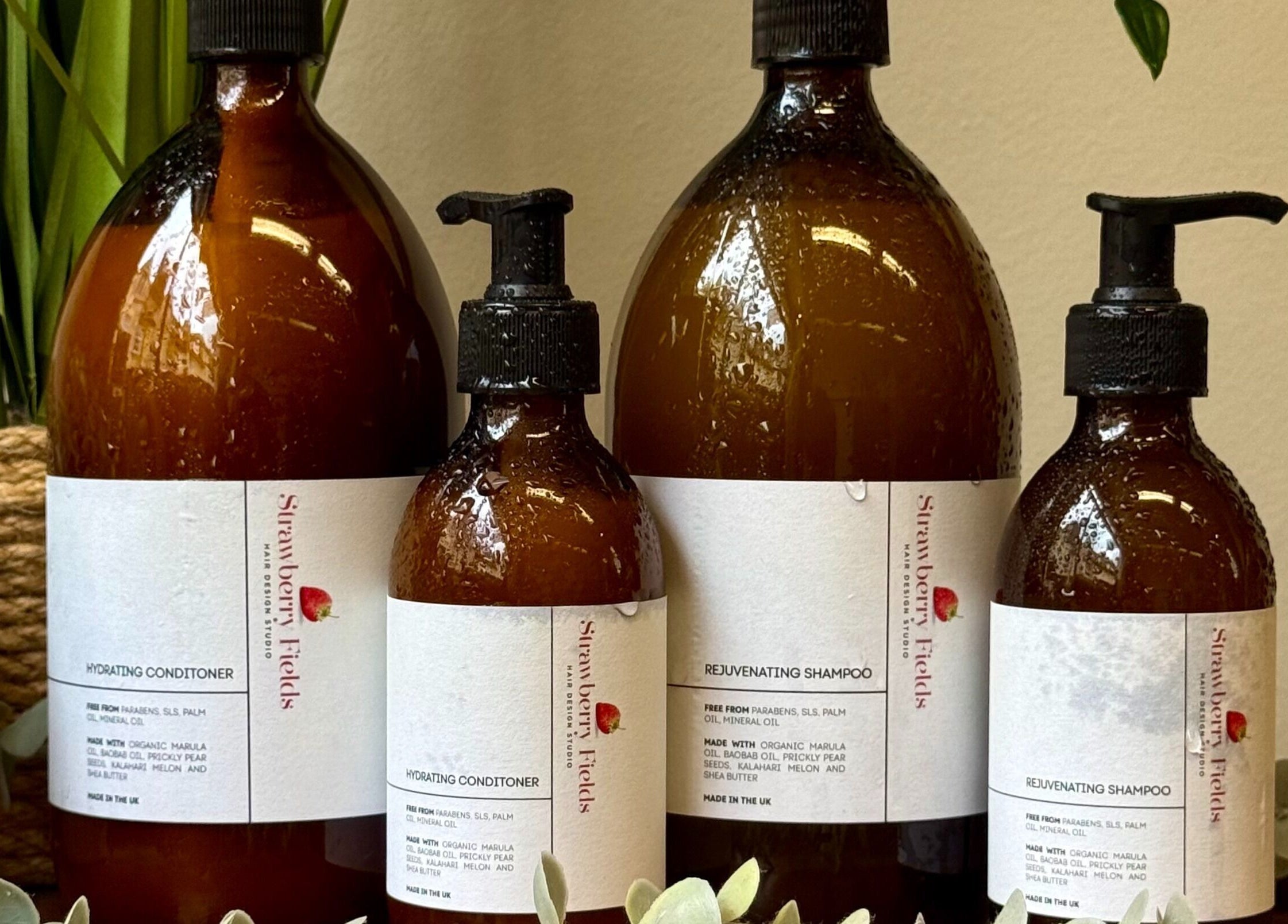 Strawberry Fields Hair Design's premium shampoo and conditioner bottles in Corsham, England, GB.