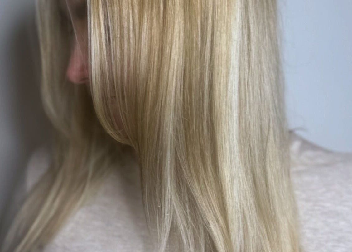 Blonde hair styled at Lmc Hair in Alloa, Scotland, GB, showcasing sleek and shiny texture.